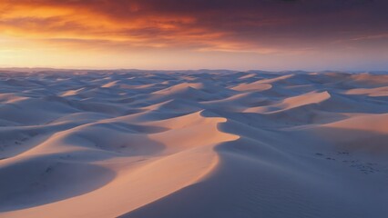 Aerial View of Expansive Desert Dunes Illuminated by the Soft Hues of Sunset