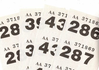 Vintage raffle tickets on a white background.