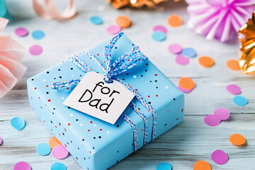 Blue gift box with tag reading 