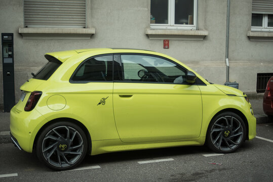 Mulhouse - France - 28 february 2025 - profile view of yellow abarth 595 parked in the street