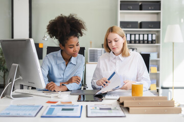Diverse professionals collaborate on project analysis with financial graphs.