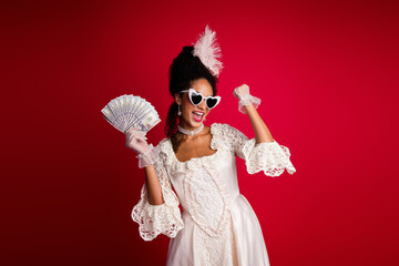 Photo of lady princess queen hold money raise fists up enjoy modern lifestyle to past time wear antique clothes isolated red color background