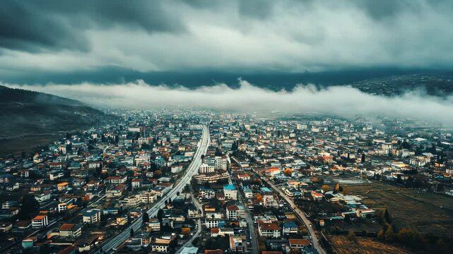 Stunning aerial view over Shkodr, Albania reveals its urban landscape and surrounding natural beauty, Aerial view around the city Shkod&Atilde;&laquo;r in Albania on a cloudy day in autumn