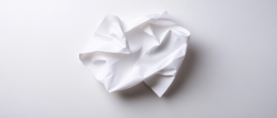 crumpled white paper on a white background