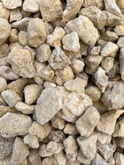 Close-up of stones on the beach,grey granite gravel background for mixed concrete