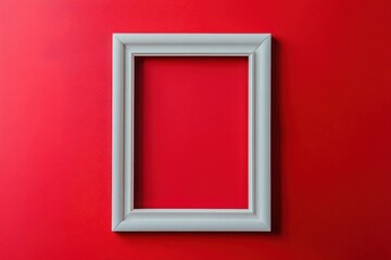 A vertical white picture frame against a vibrant red background