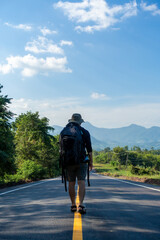 Backpackers travel to hike in the forest during the holidays.