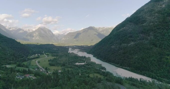 Aerial drone view Boka waterfall in Slovenia, near Bovec. Easy trekking nature trail in the forest with the view of the immense waterfall overhanging the mountains visible from the road.