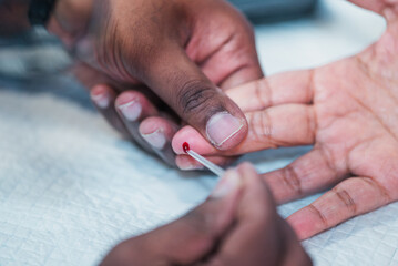 monitoring diabetes by collecting blood sample for blood sugar or glucose test