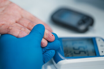 prick finger for blood sugar level healthcare checkup