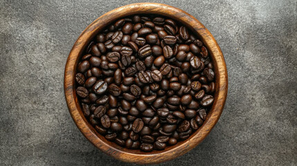Fototapeta premium Wooden bowl filled with rich dark coffee beans