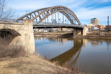 Fototapeta premium A grand city built along a majestic river, with historic bridges connecting both sides