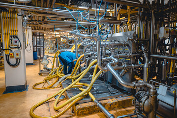 Male work inspection process stainless steel tanks and pipe with pressure meter in equipment tank facility