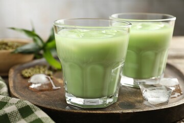 Fresh mung bean juice with ice in glasses on table, closeup