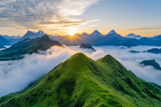 A majestic mountain range with clouds rolling over the peaks at sunrise
