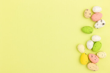 Decorative painted Easter eggs on a yellow background