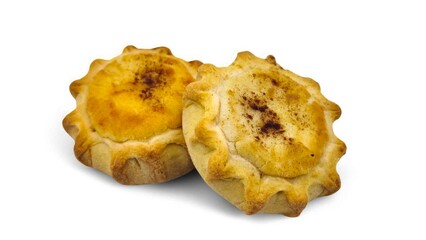 Photo of two Cretan sweet cheese pies (Kalitsounia or Lychnarakia), isolated on white background.