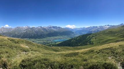 Naklejka premium Tranquil Alpine Lake with Grass-Covered Hills and Clear Blue Sky, Capturing the Essence of Summer in the Alps, Ideal for Travel and Nature-Themed Designs