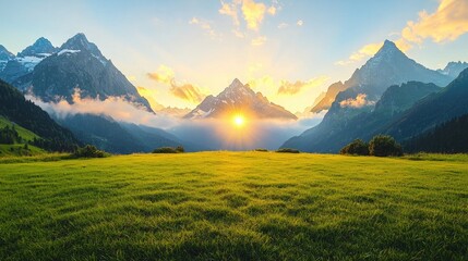 Fototapeta premium Majestic mountain peaks rise above a lush green meadow as the golden sun rises during a serene alpine morning.