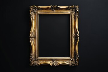 An ornate antique gold picture frame displayed against a black background