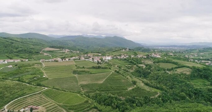 Aerial drone view pan of the Collio hills, Cormons, Nova Gorica near Gorizia. European Capital of Culture 2025. Typical local products vineyards and wines. Gonjače Tower places to visit and tradition.