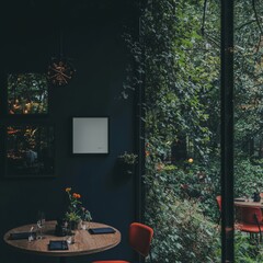 Framed poster mockup displayed in a modern cafe with Scandinavian influences, accompanied by a table, chairs, and a selection of plants