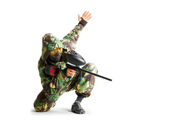 Painball player in action isolated om white bacground