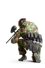 Painball player in action isolated om white bacground