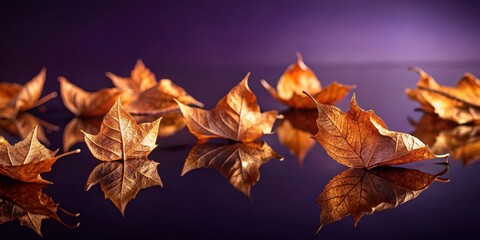 Dry orange metallic leaves scattered on a rich violet background with subtle texture and reflection, creating an eye-catching composition , texture, background