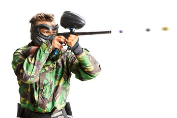 Painball player in action isolated om white bacground