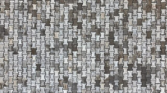 Top view of interlocking paving stone texture. Outdoor concrete slab pavement high quality drone image