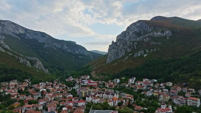 Vratsa Town At The Foothills Of The Western Balkan Mountains In Northwestern Bulgaria. Aerial Tilt-down Shot