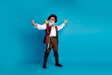 Full body photo of bearded pirate man singing performance wear hallooween costume isolated on blue...