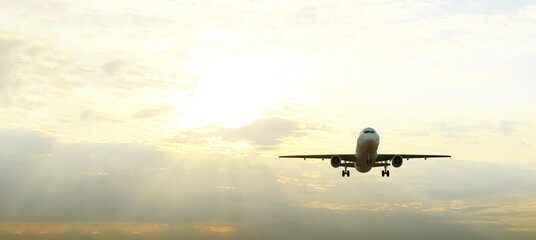 ULTRA HD. Airplane flies in sunset sky. Travel. Airplane takes off against the background of sunset sky.	
