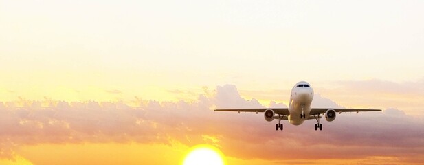 ULTRA HD. Airplane flies in sunset sky. Travel. Airplane takes off against the background of sunset sky. 