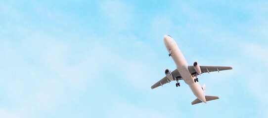 ULTRA HD. Airplane flies in blue sky. Travel. Airplane takes off against the background of blue sky.	
