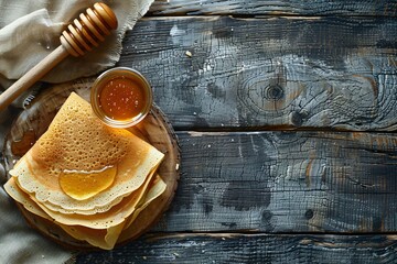 Homemade pancakes with honey on rustic wooden table. Traditional breakfast. Shrove Tuesday, Pancake Day, Mardi Gras celebration. Copy space for text.