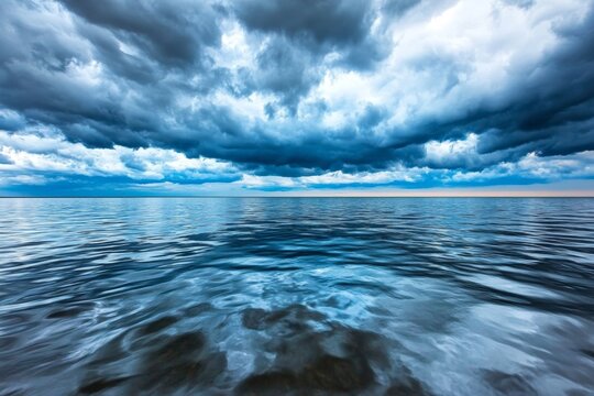A storm rolling in over a vast lake, with dark clouds reflecting on the water&acirc;&euro;&trade;s surface