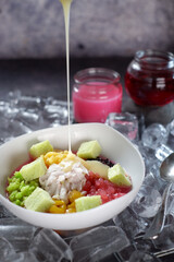 Es buah or sop buah-is an Indonesian iced fruit cocktail dessert. This cold and sweet beverage is made of diced fruits mixed with shaved ice or ice cubes, and sweetened with liquid sugar or syrup 01