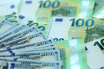 Big pile of Euro and USD banknotes. Many european and united states dollars