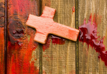 wooden cross in blood