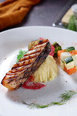 Baked salmon fillet with spinach and apple on a plate 04