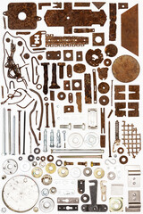 A group of various old and new parts arranged on white. Old rusty nuts, bolts, nails and other parts flay lay on white background.