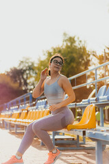 Fit girl exercises outside spot