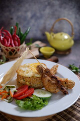 cooked rice with various spices mixed until yellowed with butter or butter oil coated with crackers 02