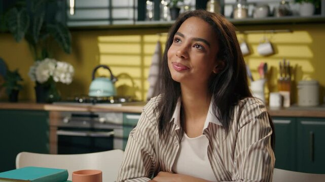 Dreaming thoughtful teen girl gen z woman high school student in kitchen thinking dream imagine remember inspired female freelancer homeowner businesswoman ponder think idea smiling studying at home