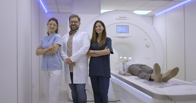 Medical Team with Patient on MRI Machine in Modern Hospital
