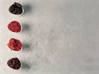 Fototapeta premium Dried fruit and vegetable on the cup and green table style.