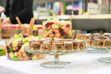 catering buffet with variety of food snacks and appetizers.