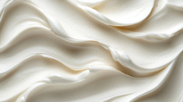 Smooth, creamy texture of white whipped cream or frosting, creating elegant waves